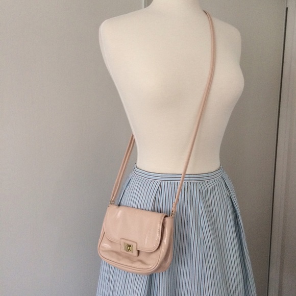 Super cute, small, baby pink cross body bag.