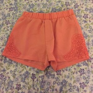 Peach loose shorts, lace on the edges