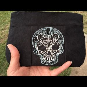 skull inset clutch purse. Microsuede purse.