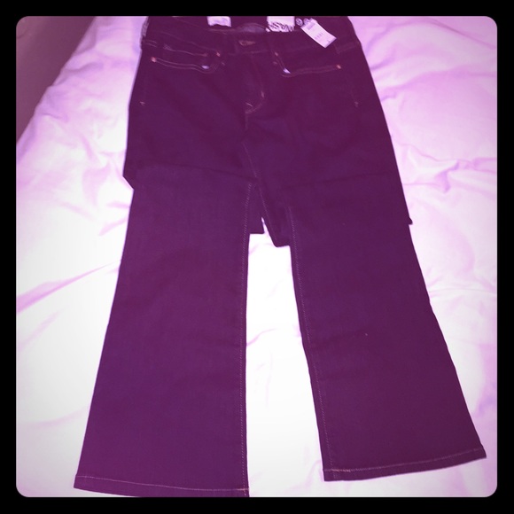 BRAND NEW boot cut jeans with tags in size 29 REG.