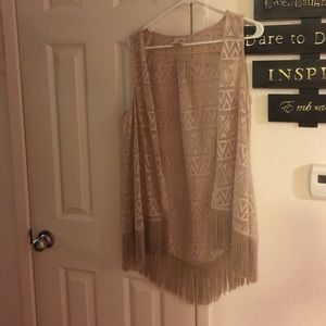 Tan vest and grey rock rival shorts