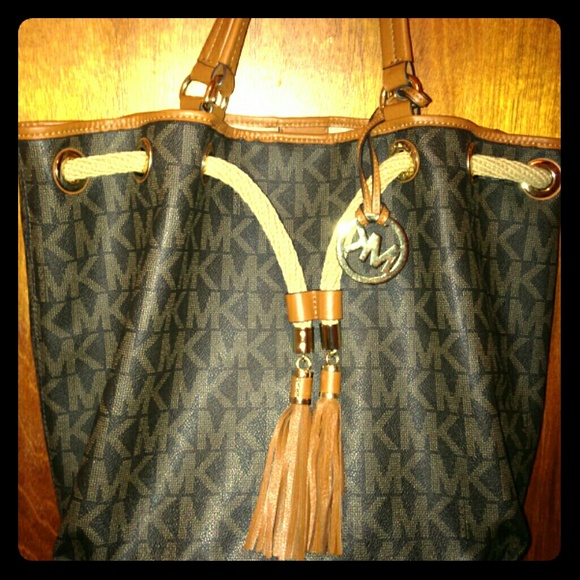 100% Authentic Michael Kors brown w/ MK logo...