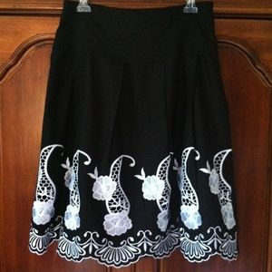 Black skirt with white embroidered flowers