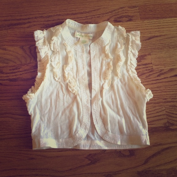 Very cute cream colored cover vest