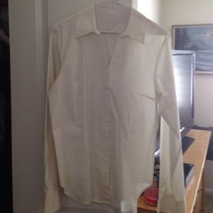 Worn once white long sleeved v neck shirt
