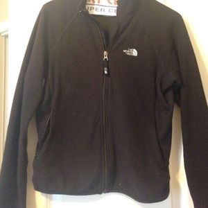 black zip up North Face jacket