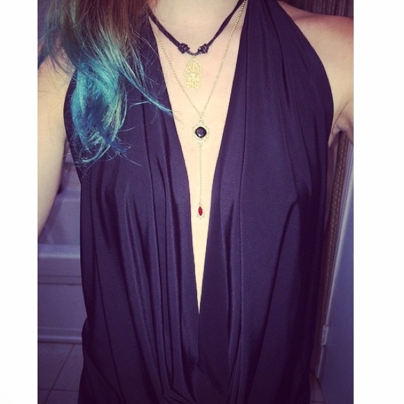 black flowy open back shirt