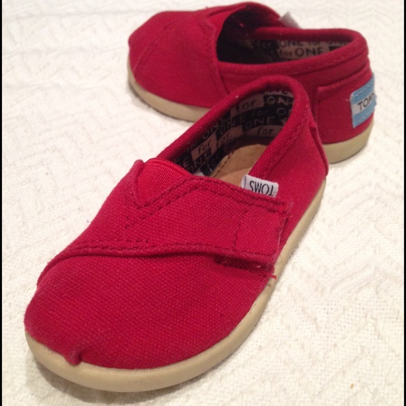 Toddler red TOMS tiny classics shoes. Size 5T.