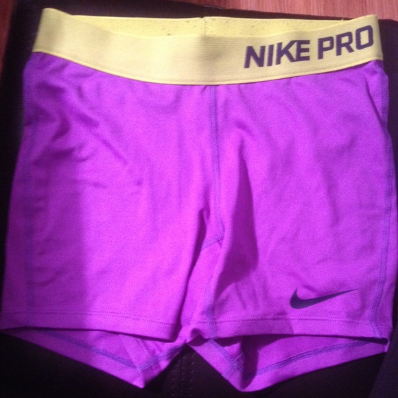 Purple and Green Nike pros