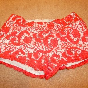 Coral and white lace shorts