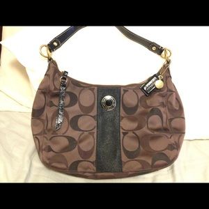 Brown and black Coach shoulder bag
