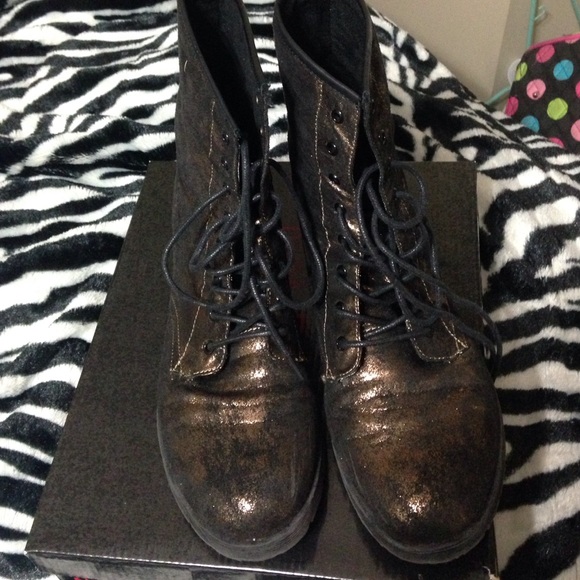 Gold and black combat boots