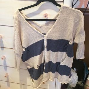 V neck blue and tan sweater with buttons