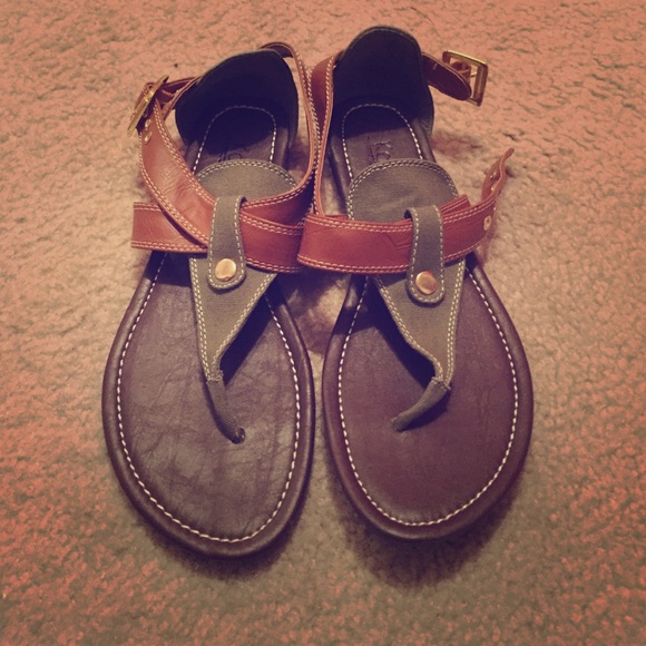 dark brown, light brown, gold, and green sandals