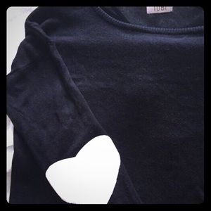 Black sweater w/ white heart-shaped elbow patches