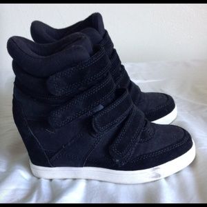 Black ALDO sneaker wedges.