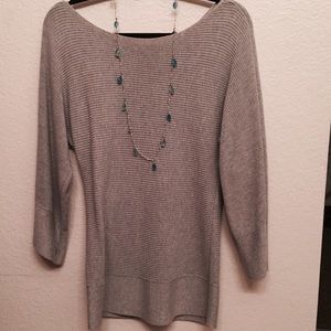 A light gray sweater very soft and comfortable