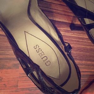 Black patent leather and snake skin heels