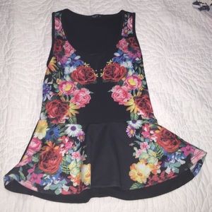 Sleeveless patterned peplum shirt