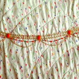 Vintage orange and gold-tone belt