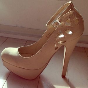 Nude heels with ankle strap and detailing in back