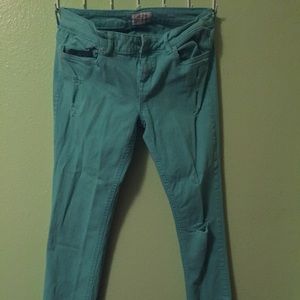 Teal distressed skinny jeans
