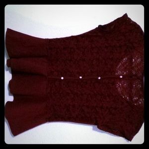 Cute burgundy blouse with a flared bottom