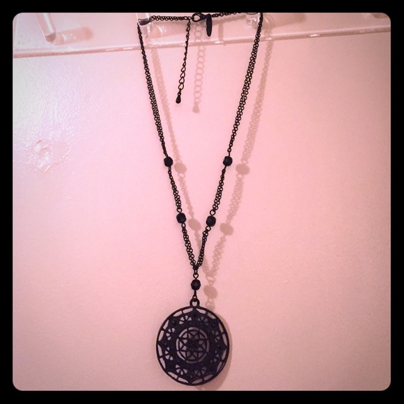 Black medallion necklace.