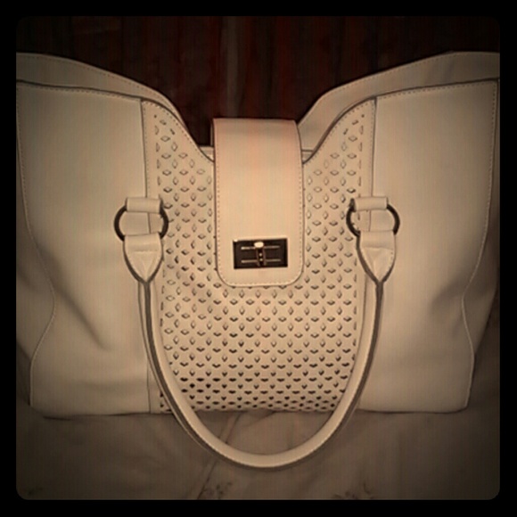 A beautiful white handbag with gold hardwear