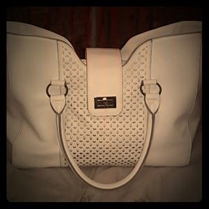A beautiful white handbag with gold hardwear