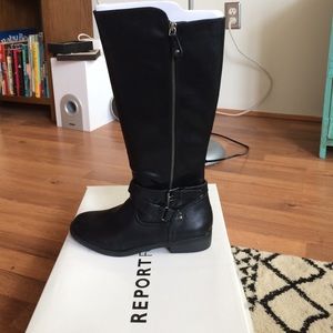 Tall black riding boots