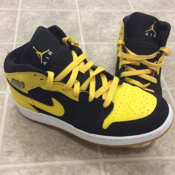 Yellow and black Jordan 1's