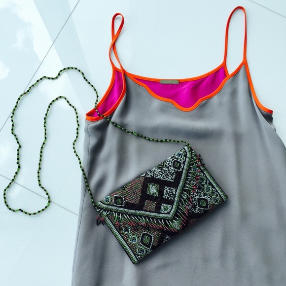 Beaded Aztec print and fringe envelope clutch.