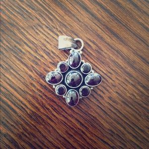 Dark jeweled medallion