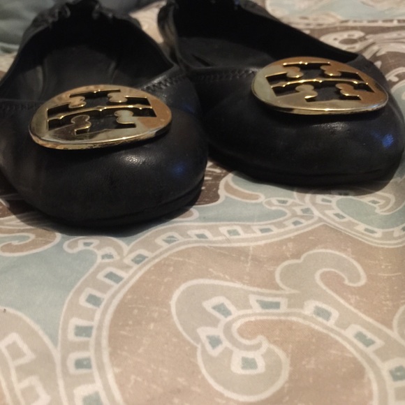 Black flats with gold buckle.