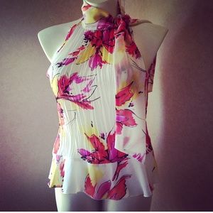 White and floral neck tie - sleeveless blouse.