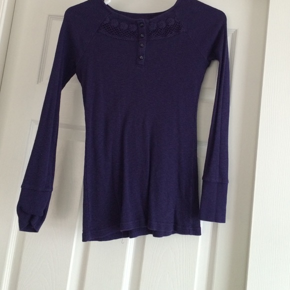 A long sleeved, dark purple top