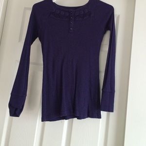 A long sleeved, dark purple top