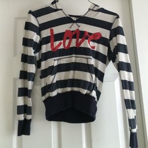 A cream white and navy blue sweatshirt.