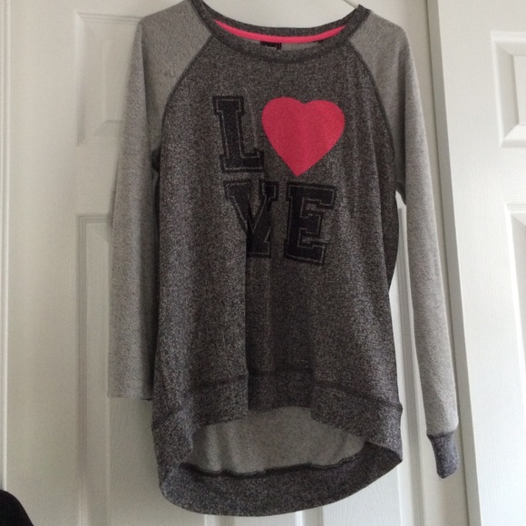 a gray, long sleeved shirt