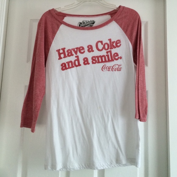 A long sleeved, white and red shirt