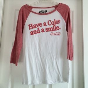 A long sleeved, white and red shirt