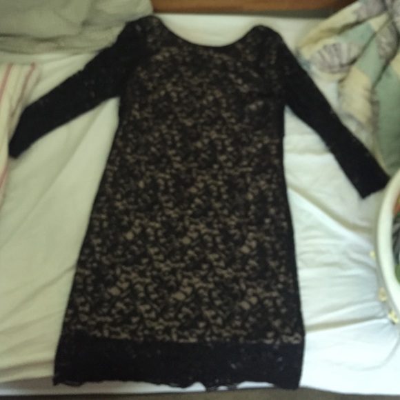 Lace bodycon dress with attached nude colored slip