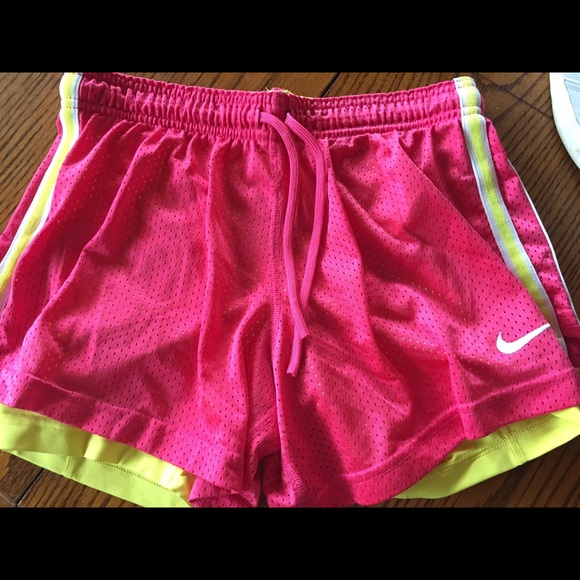 Pink Nike Dri-fit shorts with yellow lining