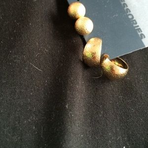 Two pairs of gold earrings.