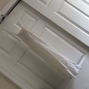 A white, cross strapped, summer dress