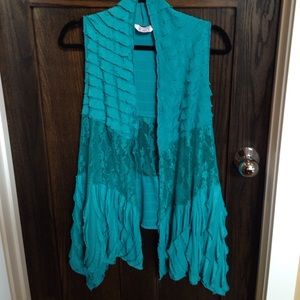 Sheer ruffle and lace vest.