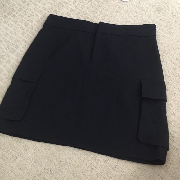 Black wool skirt with side cargo pockets