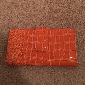 Orange wallet with checkbook