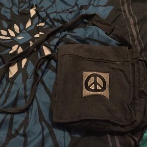 Dark blue peace sign cross body purse